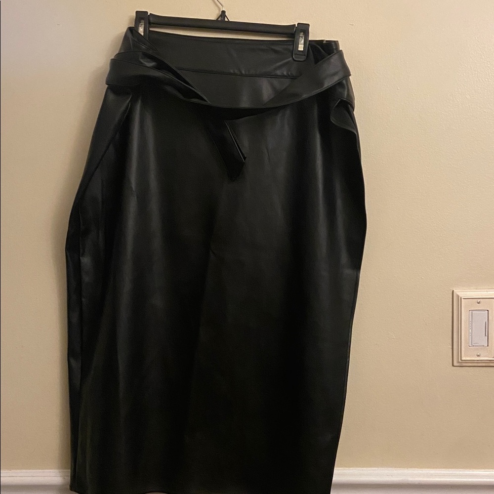 Never fully dressed vegan leather wrap skirt. Smooth texture 32” long